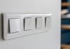 four-light-switches-macro-with-bokeh-background-minimal-design-scaled.jpg - JurnalDirect