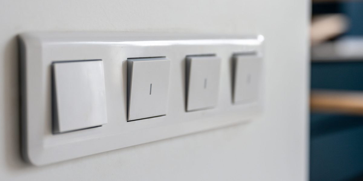 four-light-switches-macro-with-bokeh-background-minimal-design-scaled.jpg - JurnalDirect