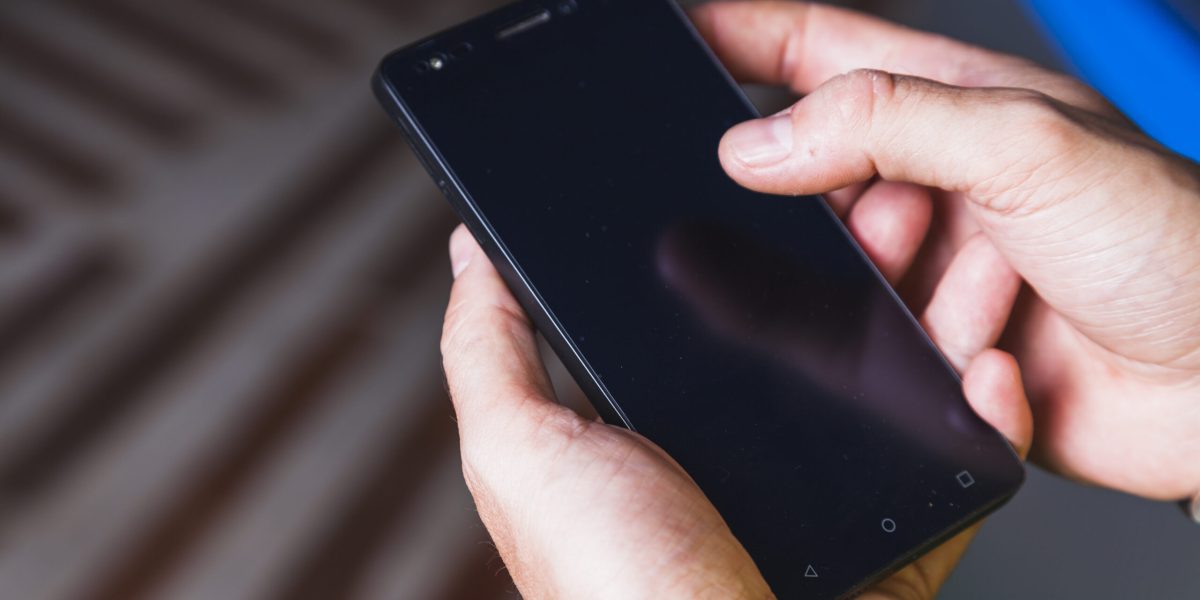 from-hand-using-smartphone-scaled.jpg - JurnalDirect