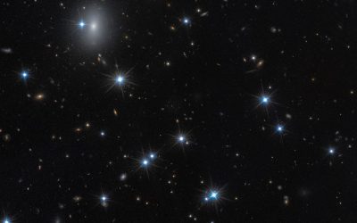 O galaxie aproape invizibilă, ascunsă într-unul dintre cele mai mari și mai interessant detailate roiuri de galaxii din Univers, a fost identificată recent cu ajutorul unor metode inovatoare